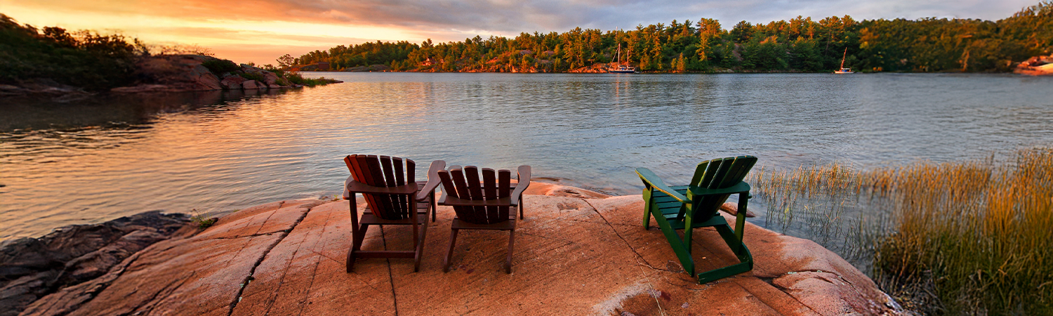Muskoka chairs by the water