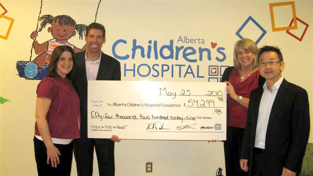Jen MacLean, Kurt Pedersen, Kathy Greenwood (Alberta Children's Hospital), and Ed Rha following our 2009 charity golf tournament.